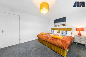 A bright and stylish bedroom featuring two zip-link single beds, perfect for flexibility and comfort.