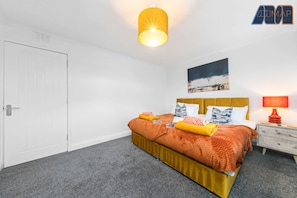 A bright and stylish bedroom featuring two zip-link single beds, perfect for flexibility and comfort.