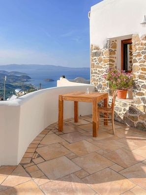 Cosy terrace with ample sitting space and panoramic view of the village, the sea and the countryside