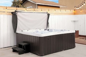 Soak and unwind in the soothing hot tub
