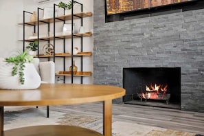 Fireplace adding warmth and ambiance to the living room