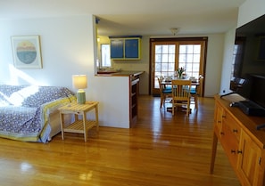 View to dining area (seats 6); deck is through sliding French door.