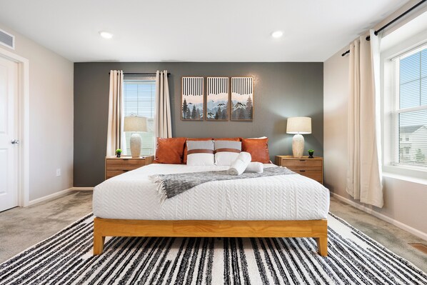 Modern cozy bedroom with natural light, stylish decor, perfect stay