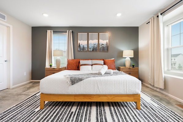 Modern cozy bedroom with natural light, stylish decor, perfect stay