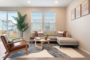 Cozy living room with natural light, perfect for relaxing or working