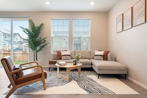 Cozy living room with natural light, perfect for relaxing or working