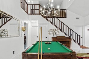 Enjoy game nights in style under soaring ceilings and warm lightning.