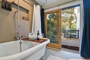 A bath with a view - clawfoot charm, fine wine, and the beauty of the outdoors.