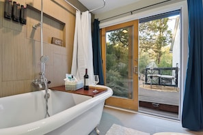 A bath with a view - clawfoot charm, fine wine, and the beauty of the outdoors.