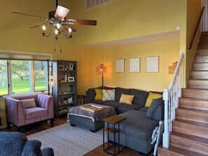 Spacious couch with chaise component that easily sleeps two.
