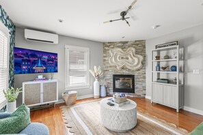 Bright and stylish with cozy seating and an electric fireplace