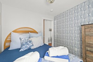Soft linens, natural light, and ample storage