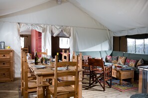 Open plan dining and living room with log burner