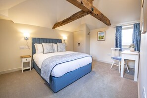 Phoenix, Goose Beck Cottages, nr York: Master bedroom featuring exposed beams