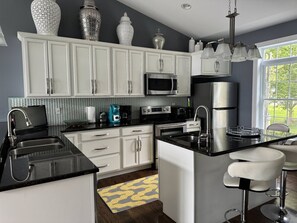 Stools with counter seating in full kitchen