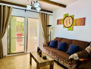 Total relaxation awaits. Our living room is this cozy and warm, with direct access to the terrace.