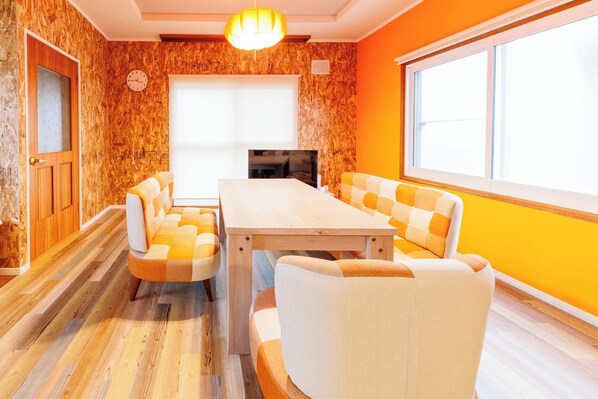 A warm orange-themed living room
