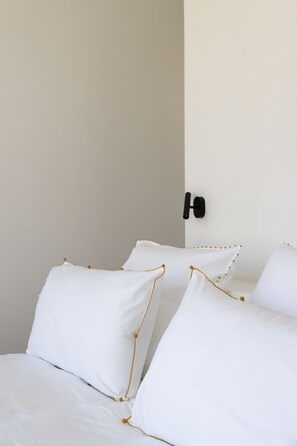 Spacious bedroom with double bed and city view