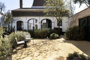 Sunny back garden with seating area