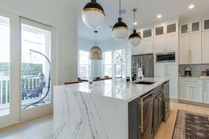 Waterfall Quartz counters, wine fridge