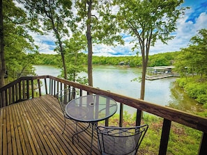 Savor your morning coffee or evening cocktails on the private deck of Unit 20, offering stunning views of the tranquil lake and surrounding nature.