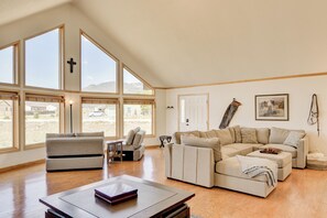 Spacious living room with two sleeper sofas (pictured left)