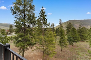 Private balcony with outdoor seating and gorgeous mountain views.