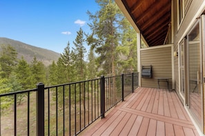 Private balcony with outdoor seating and gorgeous mountain views.
