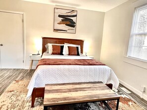 Hybrid Queen size bed. Night stands on both sides, lamps with outlet for charging, suitcase bench, dresser, closet and Smart TV