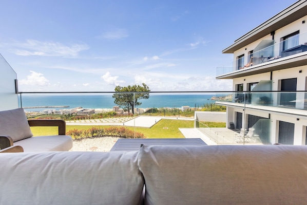2-bedroom apartment in Pederneira with sea view balcony, pool, and peaceful setting, just minutes from Nazaré beach and town center.