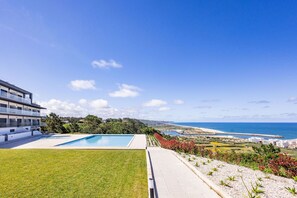 2-bedroom apartment in Pederneira with sea view balcony, pool, and peaceful setting, just minutes from Nazaré beach and town center.