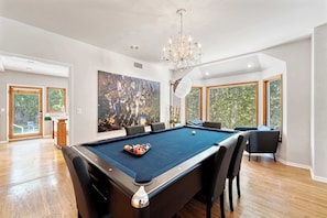 Dinner… Then a Game!
Our dining table transforms into a professional pool table—because why choose between dinner and play?