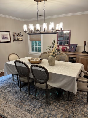 Formal dining room connected to living room.large