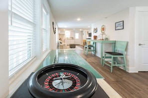Bottom floor den with game area and wet bar