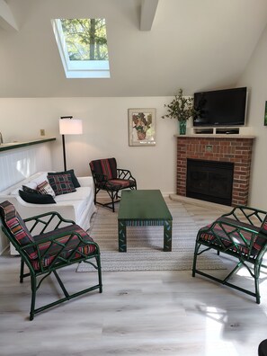 Cozy Living Room with hand-painted furniture and gas fireplace