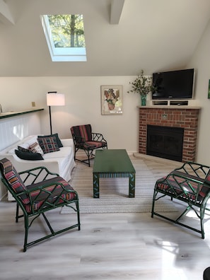 Cozy Living Room with hand-painted furniture and gas fireplace