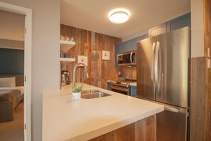 Fully equipped kitchen with sleek stainless steel appliances