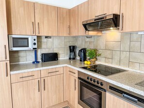 Kitchen Appliance, Kitchen, Countertop, Cabinetry, Major Appliance, Furniture, Wood, Flooring, Home Appliance, Interior Design