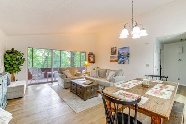 Spacious open living and dining area with Smart TV, books and board games.