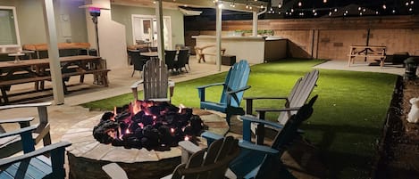 N/W facing view of the back yard at night. All the lights are on.