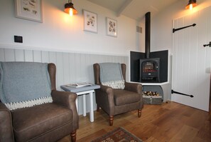 Open-plan living with a cosy electric flame-effect stove