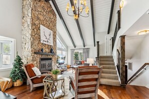 Beautiful, open concept living with vaulted ceilings, natural light, and beautiful views