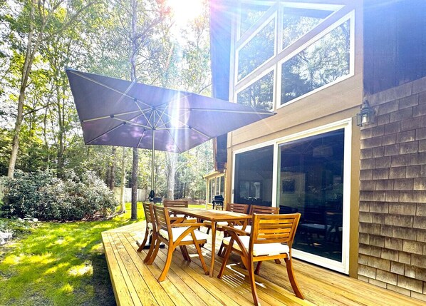 Outdoor dining table with umbrella