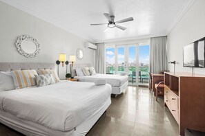 Spacious sleeping area with two inviting beds, adorned with tasteful decor and soft linens.