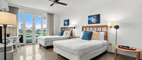 Spacious studio blending sleeping, living, and dining areas with captivating water views.