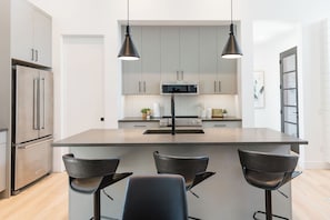 Cozy kitchen vibes with bar seating—perfect for morning coffee or evening chats