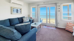 Slider from living room leads to balcony deck with water views