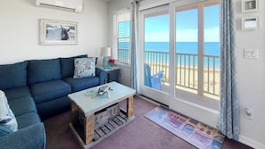 Slider from living room leads to balcony deck with water views