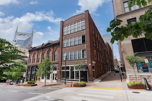 Exterior view of the building. Entrance to the home is in Banker's Alley.