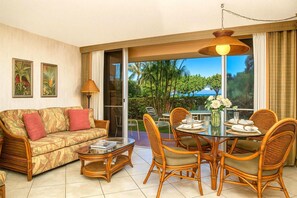 MKV-C152 Soft light filters through the palms as this open-air living space blends comfort, nature, and quiet island rhythm